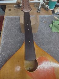 A new fingerboard with simple brass inlay dots