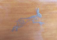 Closeup of the stencil of a hare on the soundboard